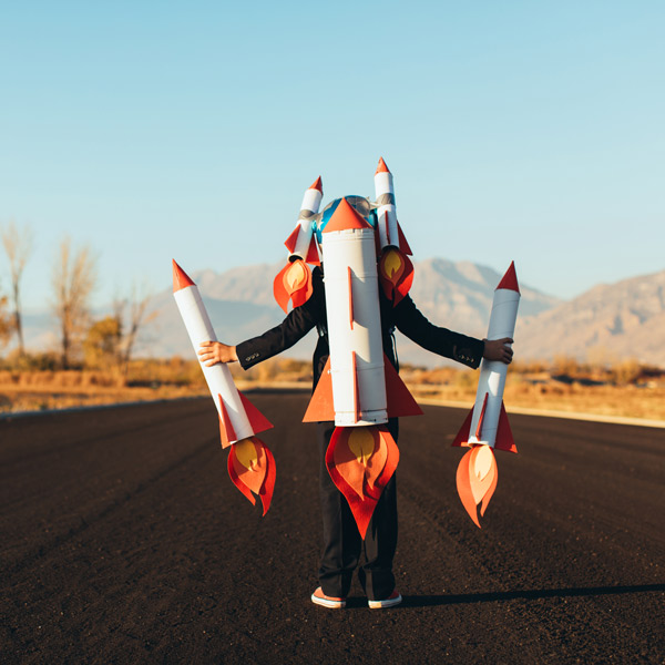Boy holding rockets